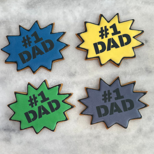 Four colorful '#1 DAD' coasters on a textured surface