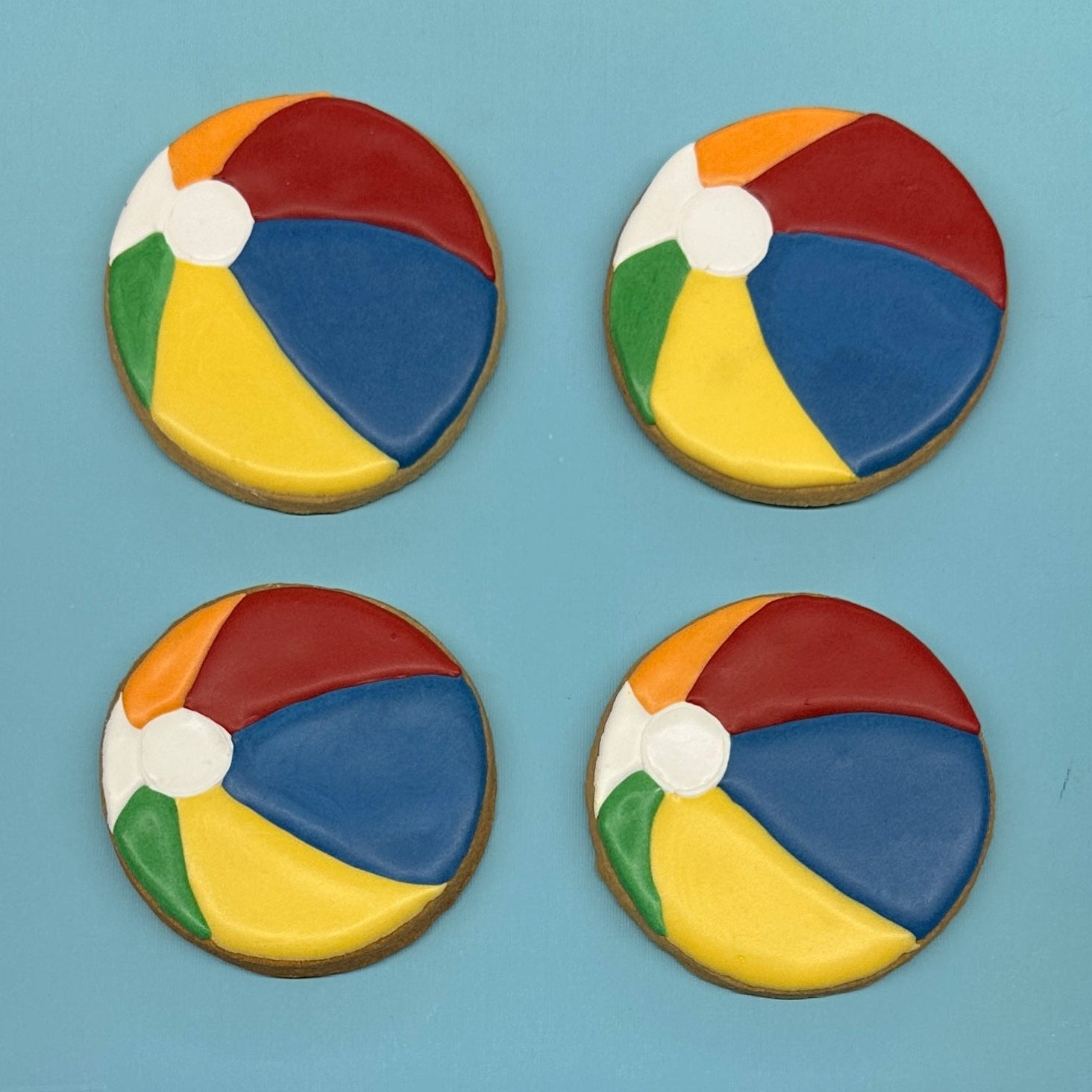 Colorful beach ball decorated sugar cookies.