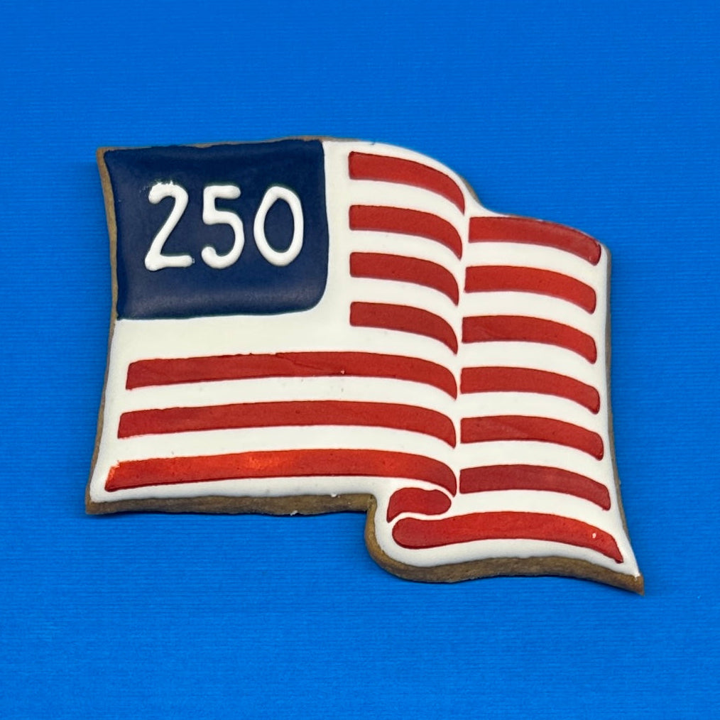 American flag-shaped cookie with '250' on a blue background
